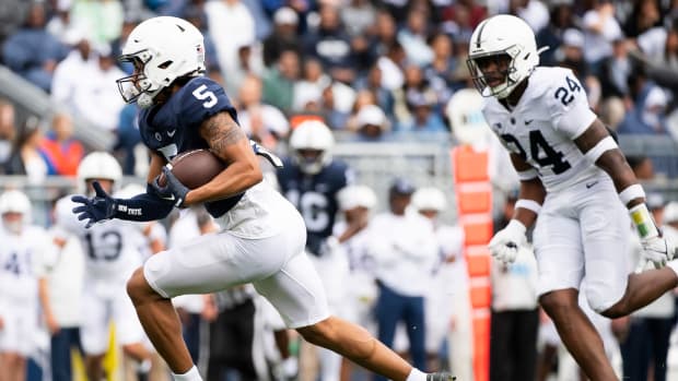 Penn State wide receiver Omari Evans runs with the football.